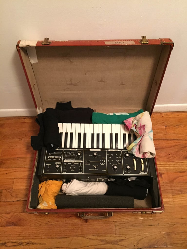Vintage Moog synth in suitcase with clothes