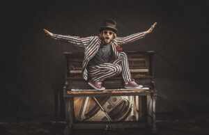 Marco Benevento on top of a piano - photo by Michael DiDonna.jpg